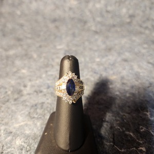 Evening Ring W/ Marquee Lab Grown Blue Sapphire Surrounded by Clear Quartz